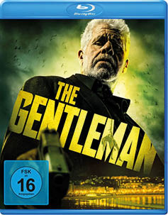 Blu-ray-H lle mit dem Titel 'THE GENTLEMAN' in gro en gelben Buchstaben, im Vordergrund eine ausgestreckte Hand mit einer Pistole, im Hintergrund eine n chtliche Stadtansicht und ein bew lkter Himmel mit fliegenden V geln.