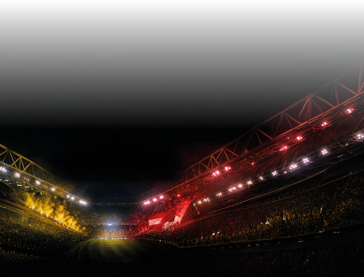 Ein gro es, beleuchtetes Stadion mit vielen Zuschauern und einer Mischung aus gelben und roten Lichtern auf den Trib nen bei Nacht. Beschreibung von KI generiert